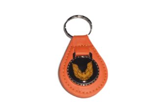 firebird or trans-am gold bird logo leather keychain - pumpkin