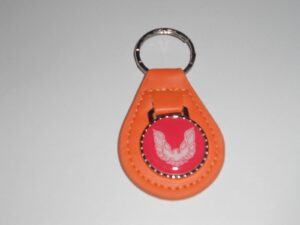 firebird or trans-am white bird logo leather keychain - pumpkin