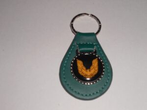 firebird or trans-am gold bird logo leather keychain - teal