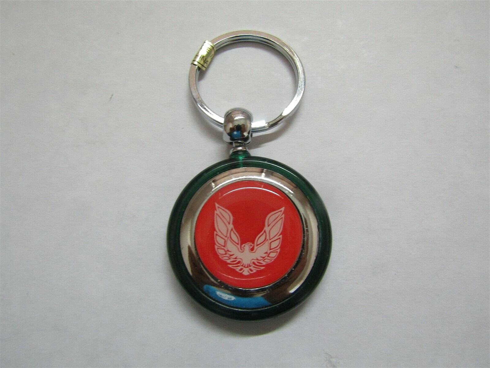 FIREBIRD OR TRANS-AM WHITE BIRD LOGO ROUND PLASTIC KEYCHAIN - GREEN