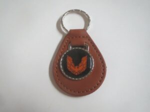 firebird or trans-am orange bird logo leather keychain - brown