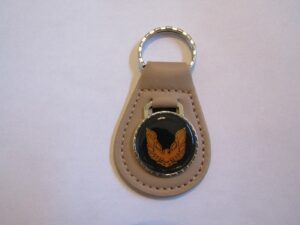 firebird or trans-am orange bird logo leather keychain - beige