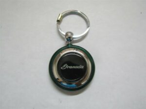 1975 1976 1977 1978 1979 1980 1981 1982 granada script logo round plastic keychain - green