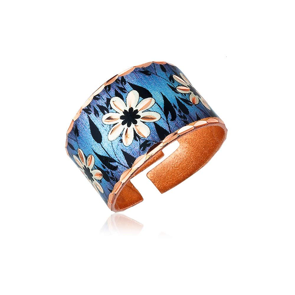 Artisan handcrafted copper cuff rings - wide cuff rings feature a daisy flower with a black leave textured leaf on a blue backdrop