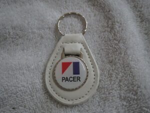 1975 1976 1977 1978 1979 amc pacer logo emblem leather keychain - white