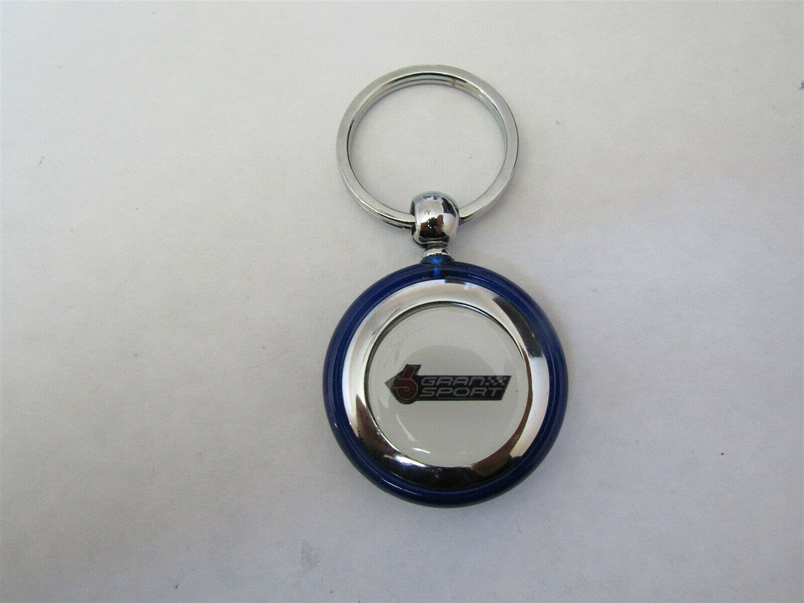 1982-1987 REGAL GRAN NATIONAL GRAN SPORT LOGO ROUND PLASTIC KEYCHAIN - BLUE