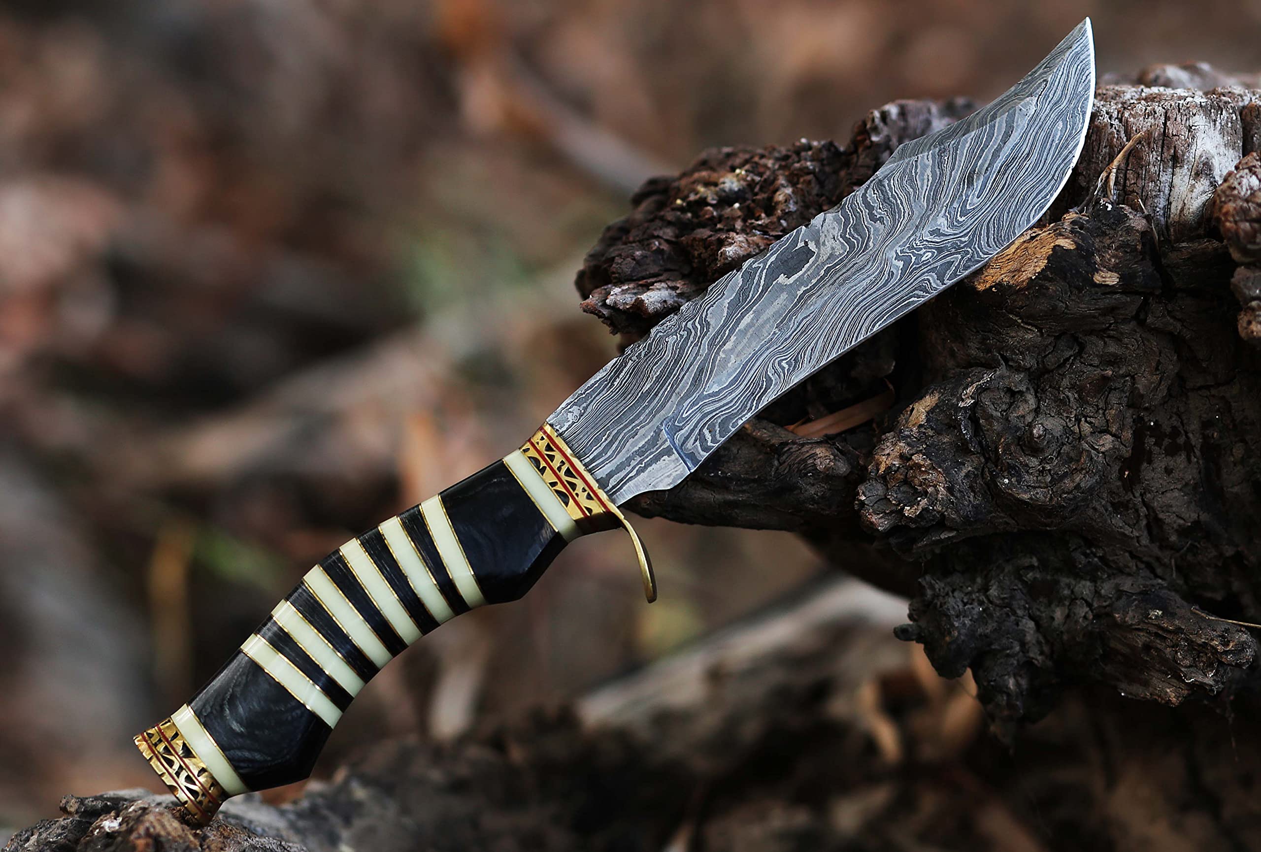 12.5 Inch long Hunting knife, Collectible knife, Scale is made of Camel bone and dollar wood, embellished with Engraved brass finger guard and pommel, Hand forged Twist pattern Damascus steel blade, Comes with Leather sheath