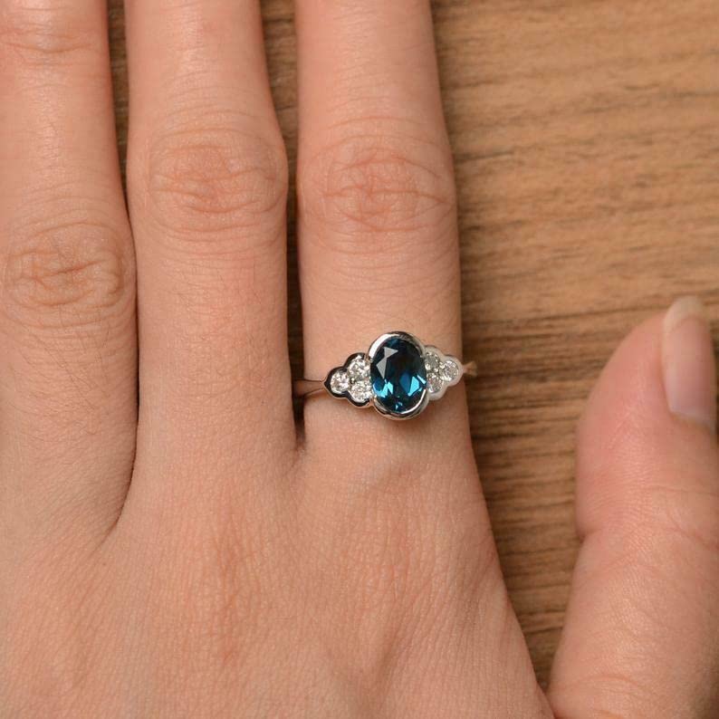 BeBold 1.2ct Oval Cut Created London Blue Topaz Floral Bezel Set Ring White Gold Plated