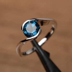 LUO S925 Sterling Silver Round Shaped 7 MM London Blue Topaz Ring Bypass Solitaire Wedding Ring Birthstone Ring for Women US Size 7.5