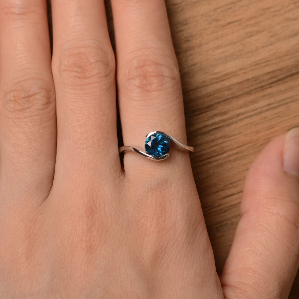 LUO S925 Sterling Silver Round Shaped 7 MM London Blue Topaz Ring Bypass Solitaire Wedding Ring Birthstone Ring for Women US Size 7.5