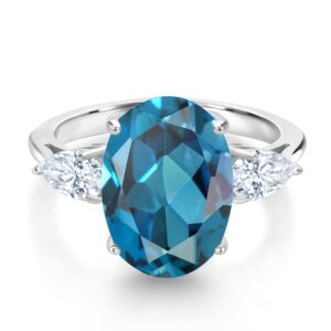 Gem Stone King 925 Sterling Silver Oval London Blue Topaz and White Moissanite 3 Stone Ring For Women (7.30 Cttw, Gemstone Birthstone, Available In Size 5, 6, 7, 8, 9)