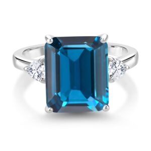 Gem Stone King 925 Sterling Silver London Blue Topaz and White Moissanite 3 Stone Ring For Women (7.82 Cttw, Gemstone Birthstone, Emerald Cut 12X10MM, Available In Size 5, 6, 7, 8, 9)