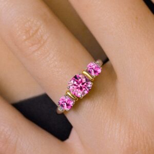 Gem Stone King 925 Sterling Silver and 10K Yellow Gold Pink Moissanite and Pink Created Sapphire 3 Stone Engagement Ring For Women (1.69 Cttw, Cushion Cut 6MM and 4MM, Available In Size 5, 6, 7, 8, 9)