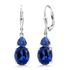 gem stone king 925 sterling silver blue created sapphire dangle earrings for women (7.68 cttw, gemstone september birthstone, oval 10x8mm, trillion 5mm)