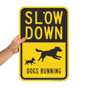 SmartSign 18 x 12 inch “Slow Down - Dogs Running” Metal Sign with Symbols, 63 mil Laminated Rustproof Aluminum, Black and Yellow, Made in USA