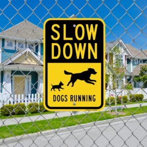 SmartSign 18 x 12 inch “Slow Down - Dogs Running” Metal Sign with Symbols, 63 mil Laminated Rustproof Aluminum, Black and Yellow, Made in USA