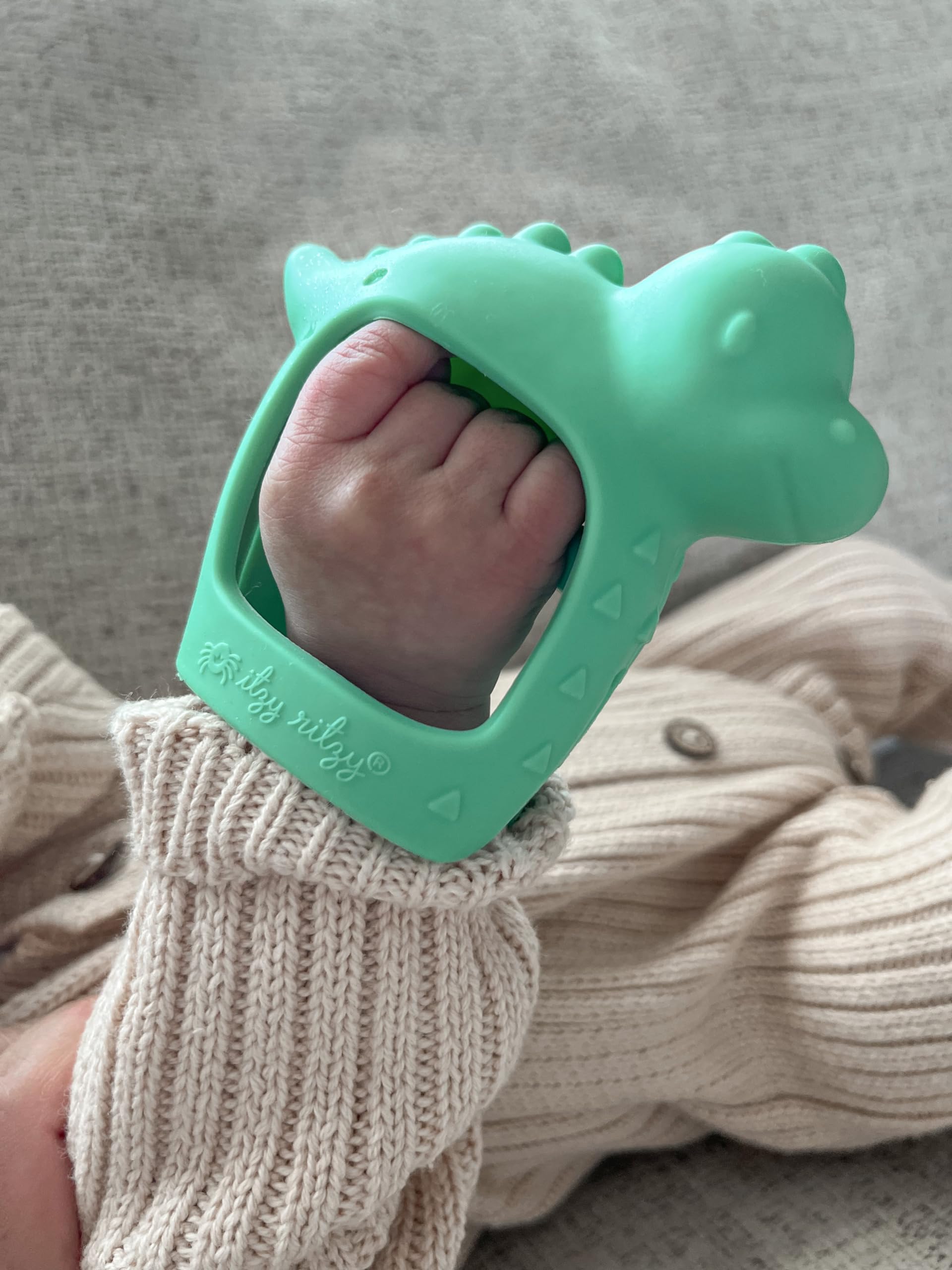 Itzy Ritzy Bitzy Grip Hand Teether - Silicone Teether for Babies - Developmental Teether Toy with Easy-to-Hold Hand Grip, Designed for Babies 3 Months & Up (Dinosaur)