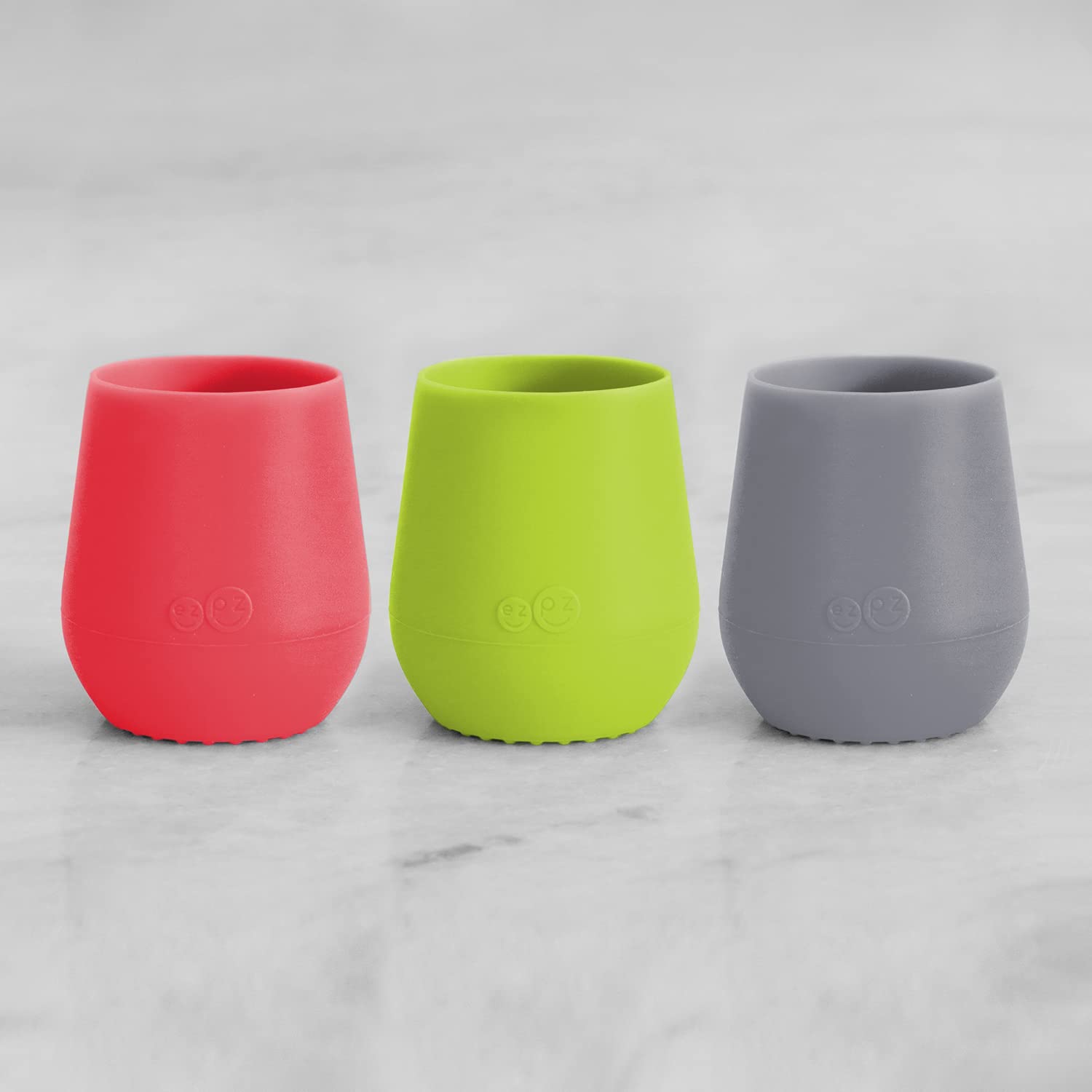 ezpz Tiny Cup 3-Pack (Coral, Lime & Gray) - 100% Silicone Training Cup for Infants - Designed by a Pediatric Feeding Specialist - 4 months+ - Baby-led Weaning Gear & Baby Gift