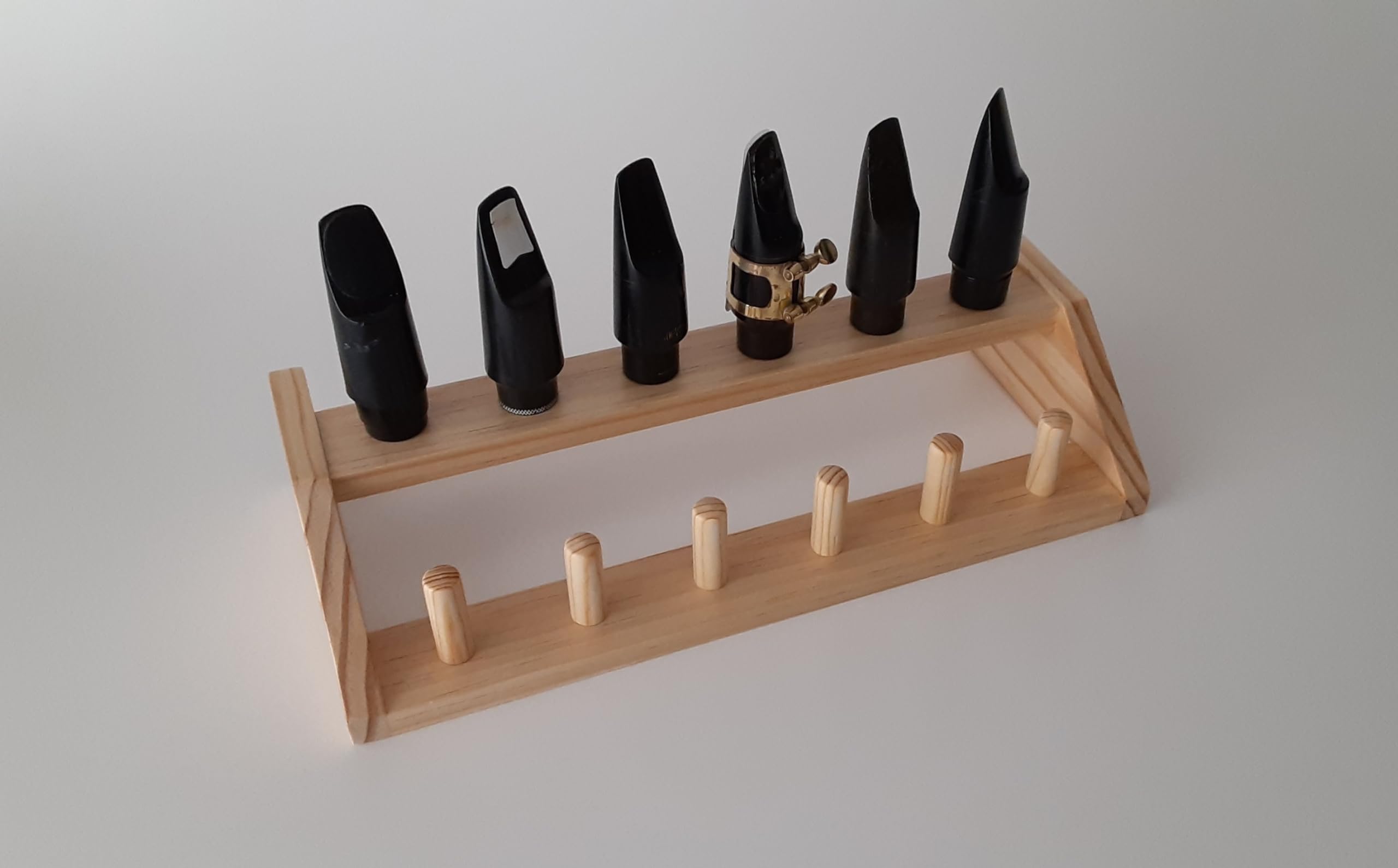 Saxophone mouthpiece wooden stand holder rack for 12 mouthpieces.