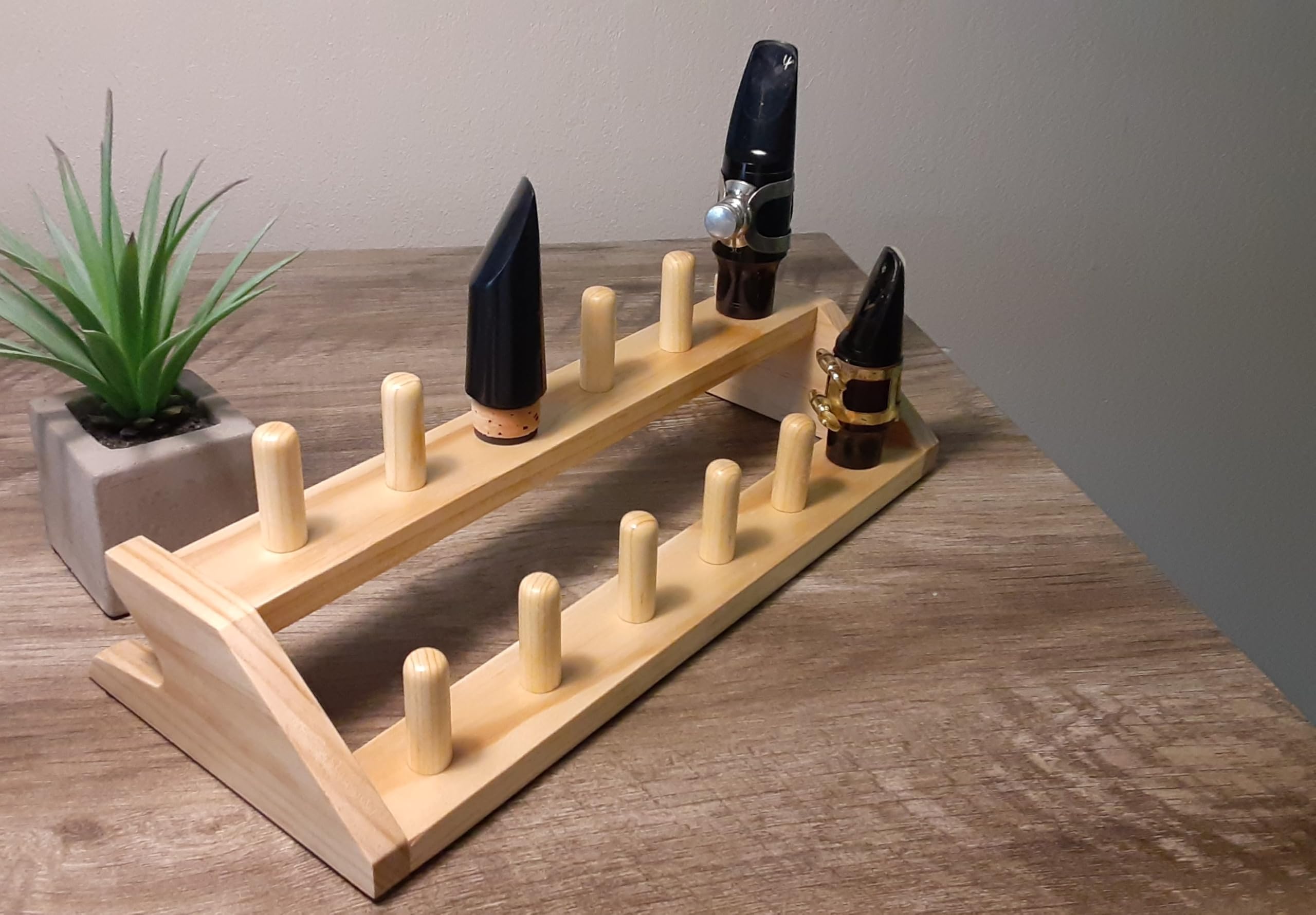 Saxophone mouthpiece wooden stand holder rack for 12 mouthpieces.