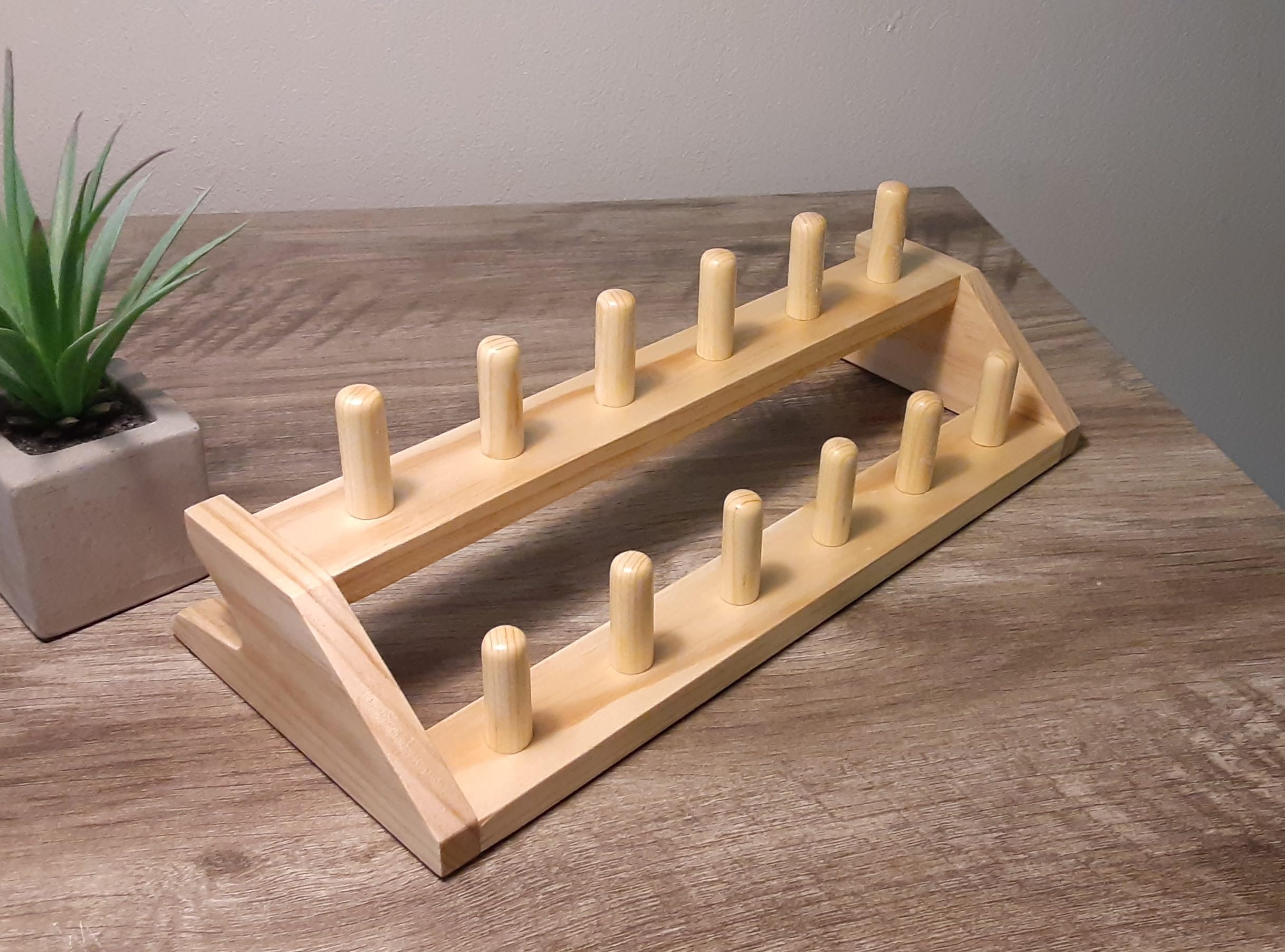 Saxophone mouthpiece wooden stand holder rack for 12 mouthpieces.