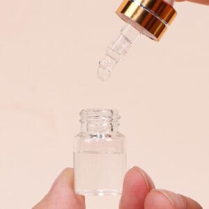 Comrzor 50 Pack 2ml Clear Glass Dropper Bottles with 2 Pcs Plastic Droppers, Mini Sample Dropper Bottles for Essential Oils Perfume Cosmetic Liquid, Empty Travel Sample Vials with Gold Cap