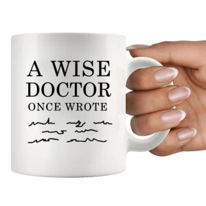 Panvola A Wise Doctor Once Wrote Funny Doctor Gifts Dr Mom Dad Husband Wife Boyfriend Girlfriend Graduation Gifts For New Physician Surgeon Medical Student MD Practitioner Ceramic Mug (11 oz, White)