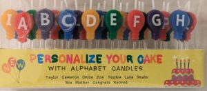 personalize with unique balloon birthday candles | spell the guest of honors name | letters a to z | wax candles