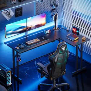 MOTPK L Shaped Gaming Desk with Led Lights, 51 Inch Gaming Computer Desk with Carbon Fiber Texture, Pc Gaming Table with Power Outlet and Headphone Hook, L Desk for Gaming, Black