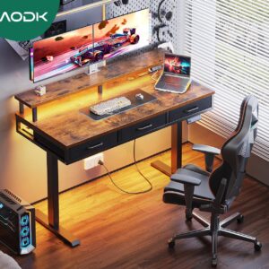 AODK Electric Standing Desk with Drawers, 55 Inch Height Adjustable Gaming Desk with Power Outlets & LED Lights, Sit Stand Table with Monitor Stand for Home, Office, Workstation, Rustic Brown