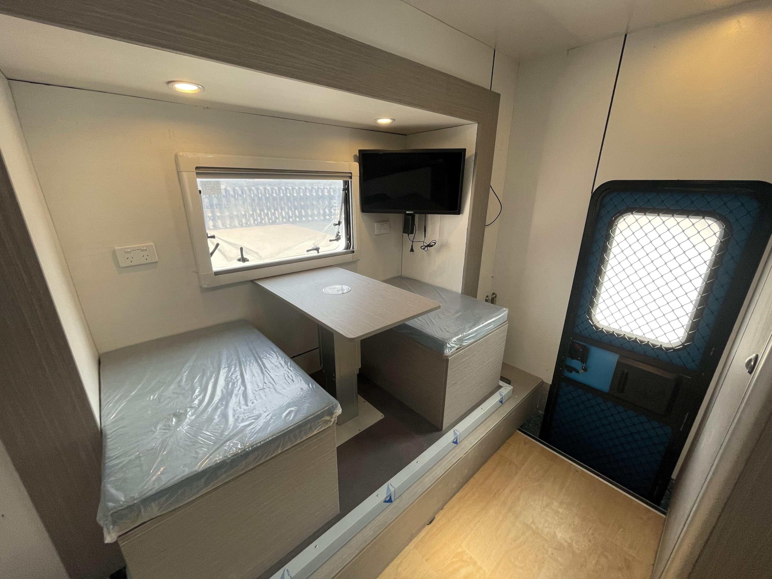 Truck Camper with Bed/Foldable Sofa/Bathroom/Kitchen and Cabinets.