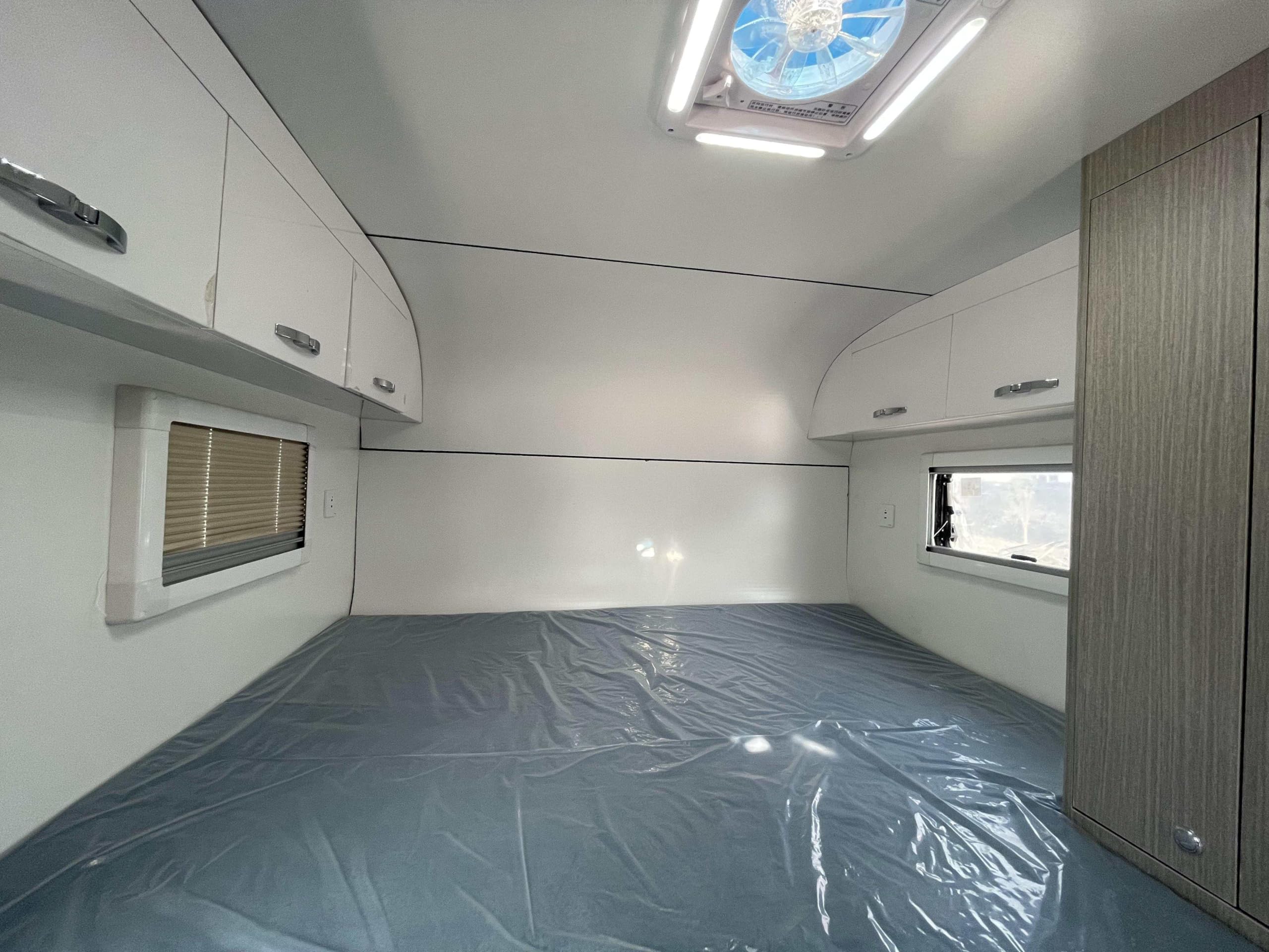 Truck Camper with Bed/Foldable Sofa/Bathroom/Kitchen and Cabinets.