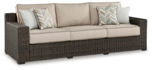 signature design by ashley coastline bay casual weather resistant outdoor sofa with cushion and 4 throw pillows, beige & dark brown