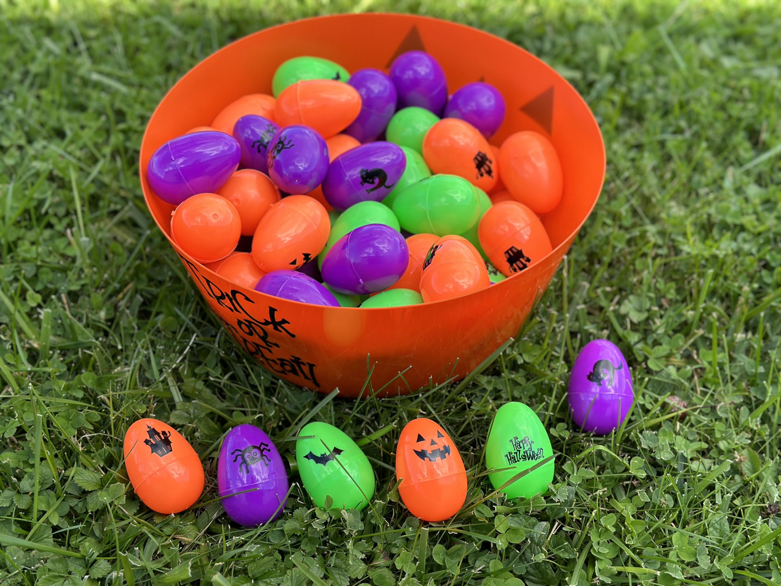 Iconikal 72-Count Halloween Eggs - Durable Plastic Holiday Treat Containers in Orange, Neon Green, and Purple Featuring 6 Different Fun Designs (2.3 x 1.6)