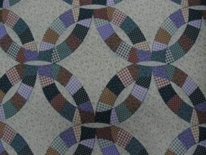 90" wide cheater quilt top fabric double wedding ring color hunter. fabric is sold by the yard and cut to order. for example, order of 1 yard(qty=1) is 90"x36". order of 3 yards(qty=3) is 90"x108".