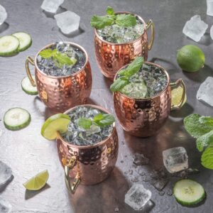 BOLD & DIVINE Copper Plated Moscow Mule Mugs Set of 4 | 18 Oz Hammered Copper Cups with Stainless Steel Lining Gold & Brass Handles with Copper Straws & Shot Glass | Perfect for Bars, Parties & Gifts