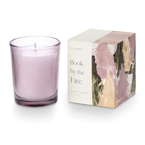 illume far & away boxed votive candle, book by the fire