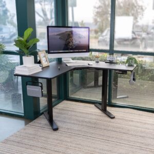 Mount-It! Electric Height Adjustable Corner Stand Up Desk, Black Steel Frame L-Shaped Standing Workstation for Corners, Automatic Sit Stand Desk, Smoothly Raises from 28.3" to 47.2", Home Office