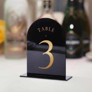 UNIQOOO Black Arch Wedding Table Numbers with Stands 1-15, Gold Foil Printed 5x7 Double Sided Acrylic Signs and Holders, Perfect for Centerpiece, Reception, Decoration, Party, Anniversary, Event