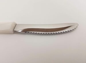 cutco model 1759 table knife with white (pearl) handle....................3.4” high carbon stainless dd serrated blade.............in factory sealed plastic bag.