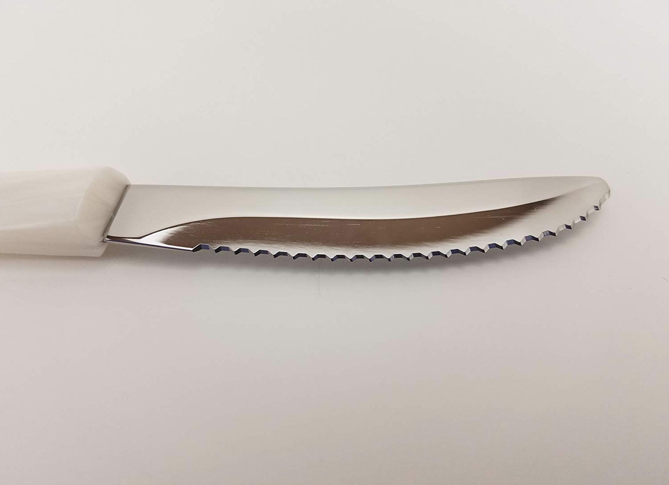 CUTCO Model 1759 Table Knife with White (Pearl) handle....................3.4” High Carbon Stainless DD serrated blade.............in factory sealed plastic bag.