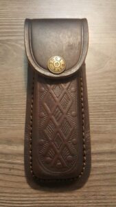 brown textured leather knife sheath - holds a buck 110. 5" case. antique snap