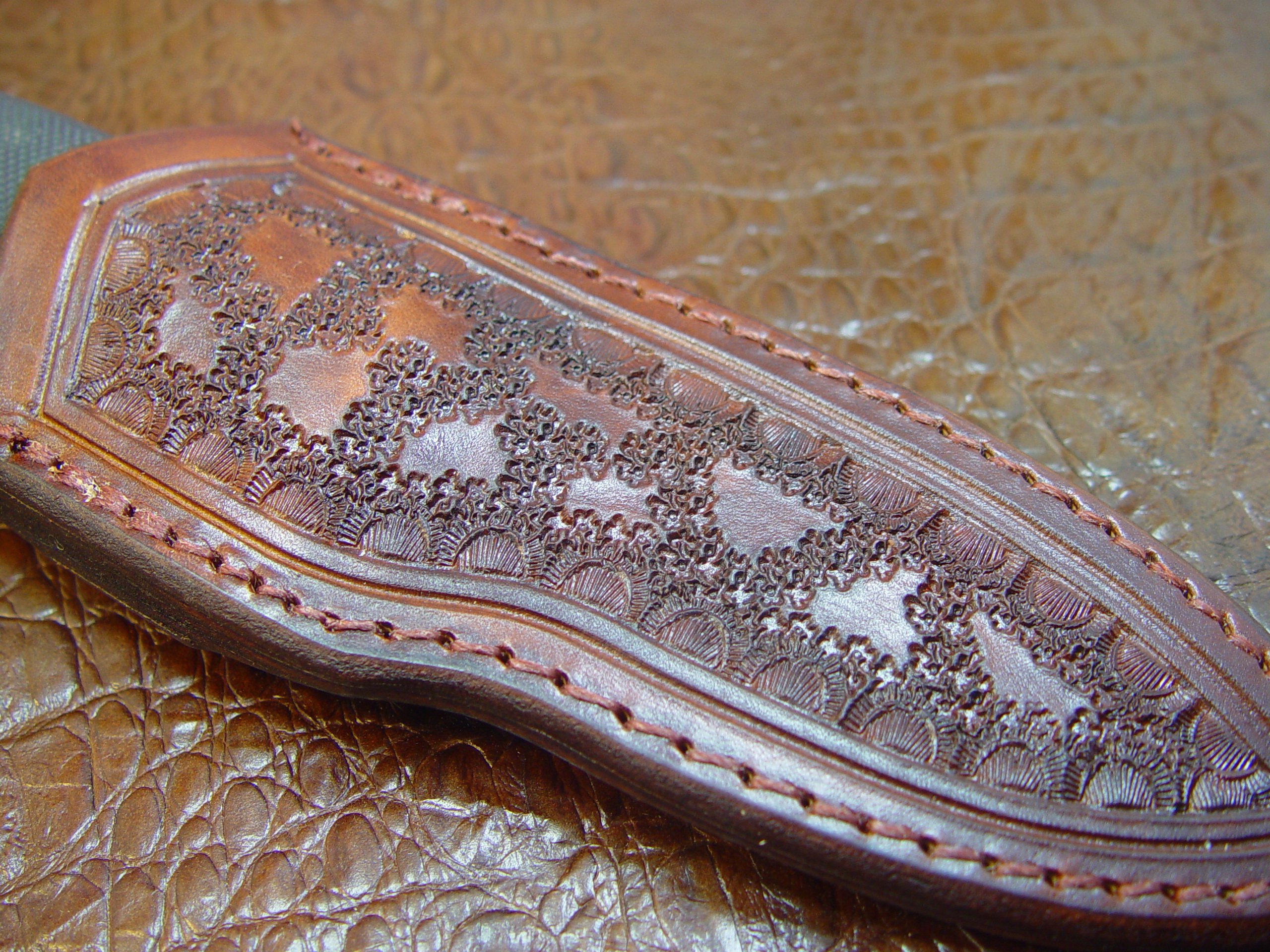 by Carl Thomas Jr. Custom Leather Knife Sheath That Fits a Buck 692 Vanguard or Zipper. Tooled and Dyed Dark Brown.