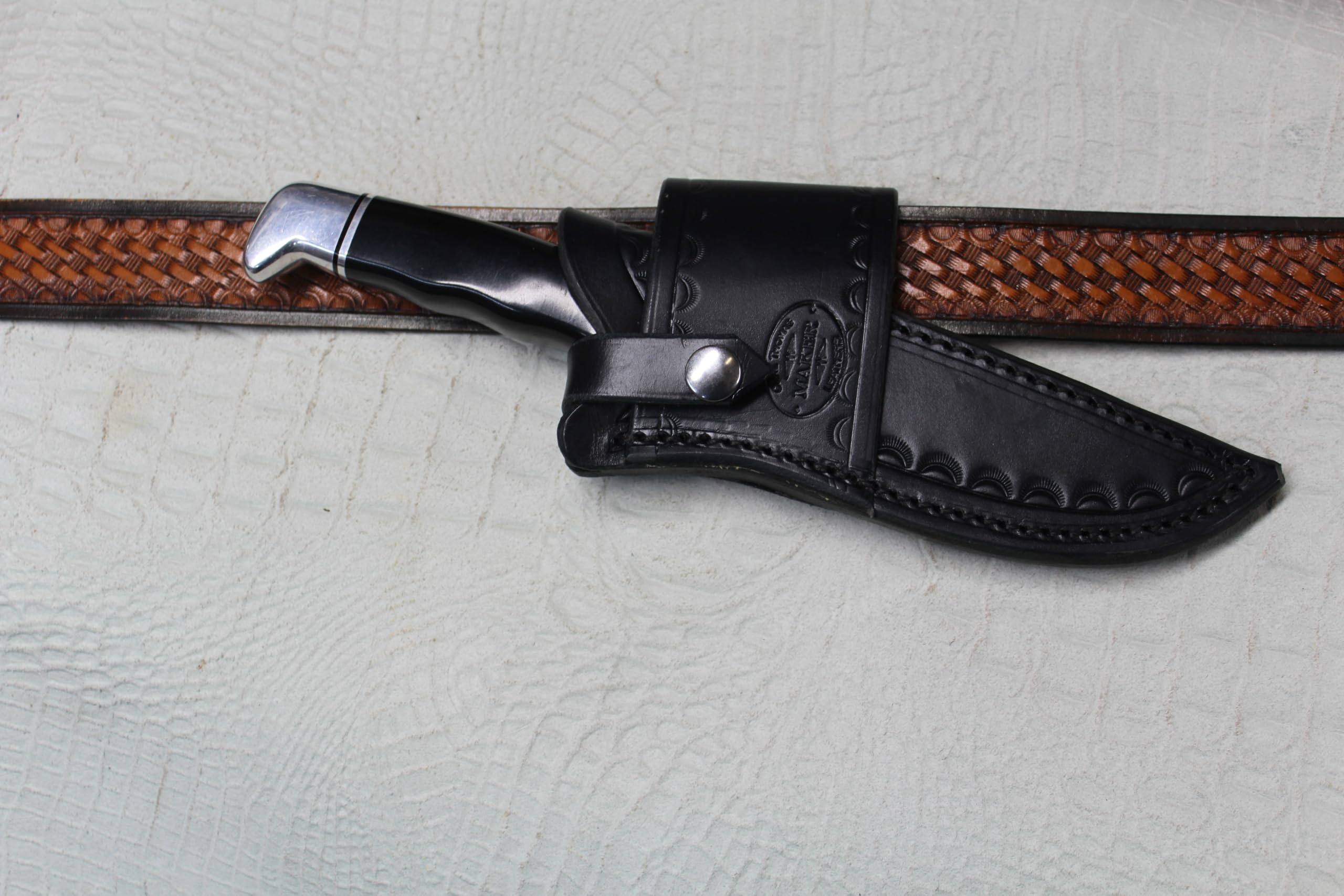 Buck 119 Cross Draw Knife Sheath. This Sheath Is Made Out of 8 Ounce Leather the Leather Is Very Soft Durable and Pliable You Will Not Need to Line Your Sheath for Your Finer Knives. The Leather Is Dyed Black with Border Tooling. The Sheath Can Be Worn on