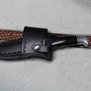 Buck 119 Cross Draw Knife Sheath. This Sheath Is Made Out of 8 Ounce Leather the Leather Is Very Soft Durable and Pliable You Will Not Need to Line Your Sheath for Your Finer Knives. The Leather Is Dyed Black with Border Tooling. The Sheath Can Be Worn on