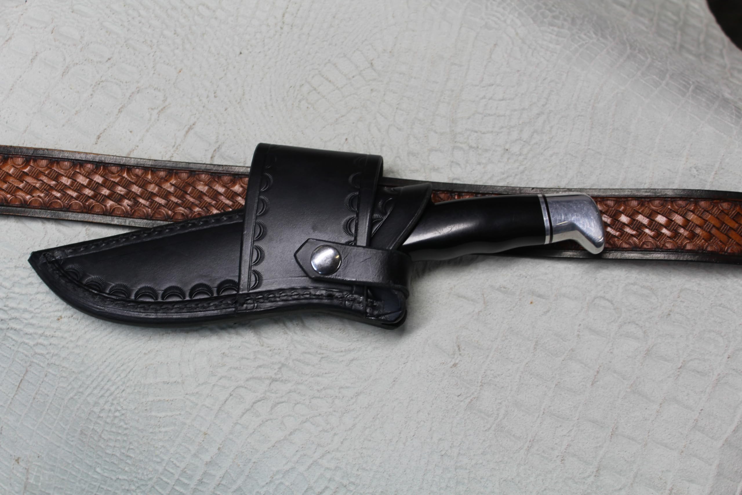 Buck 119 Cross Draw Knife Sheath. This Sheath Is Made Out of 8 Ounce Leather the Leather Is Very Soft Durable and Pliable You Will Not Need to Line Your Sheath for Your Finer Knives. The Leather Is Dyed Black with Border Tooling. The Sheath Can Be Worn on