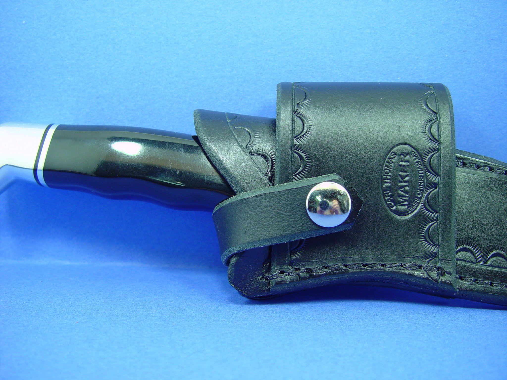 Buck 119 Cross Draw Knife Sheath. This Sheath Is Made Out of 8 Ounce Leather the Leather Is Very Soft Durable and Pliable You Will Not Need to Line Your Sheath for Your Finer Knives. The Leather Is Dyed Black with Border Tooling. The Sheath Can Be Worn on