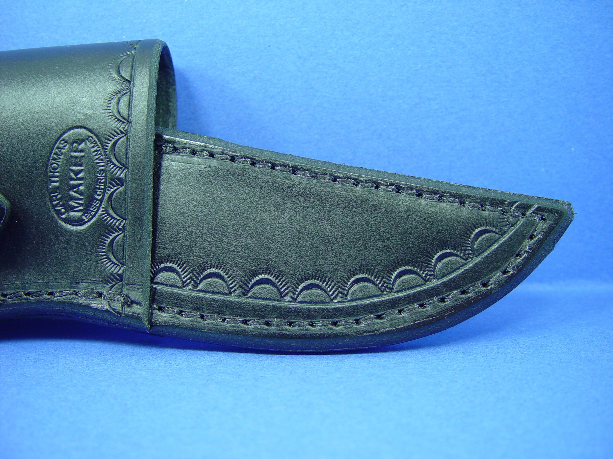 Buck 119 Cross Draw Knife Sheath. This Sheath Is Made Out of 8 Ounce Leather the Leather Is Very Soft Durable and Pliable You Will Not Need to Line Your Sheath for Your Finer Knives. The Leather Is Dyed Black with Border Tooling. The Sheath Can Be Worn on