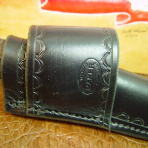 Custom cross draw knife sheath for the buck Selkirk knife. The sheath is made out of water buffalo hide leather Black.