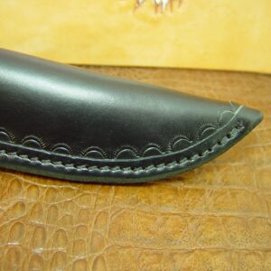 Custom cross draw knife sheath for the buck Selkirk knife. The sheath is made out of water buffalo hide leather Black.